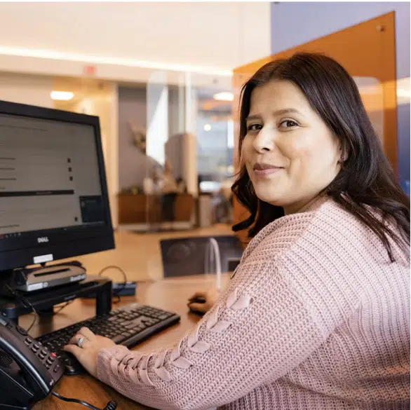 Woman working on her computer about new credit loans