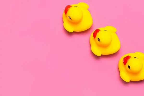 Rubber ducks, pink backdrop