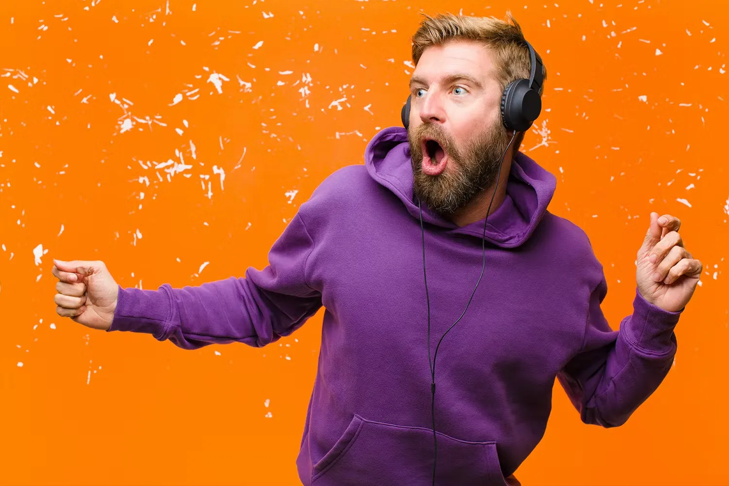 Man enjoying music through headphones