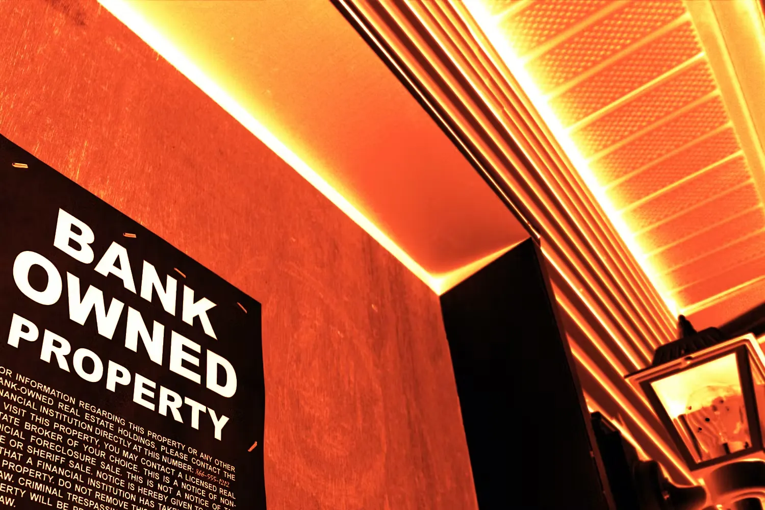 Sign on wall reading "Bank Owned Property"