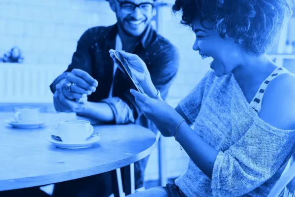 Woman laughing looking at phone