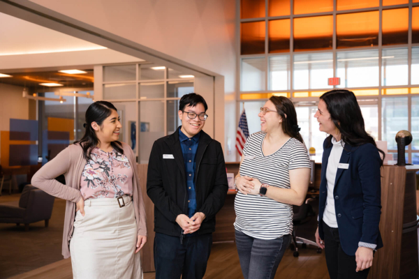 Amplify employees smiling together